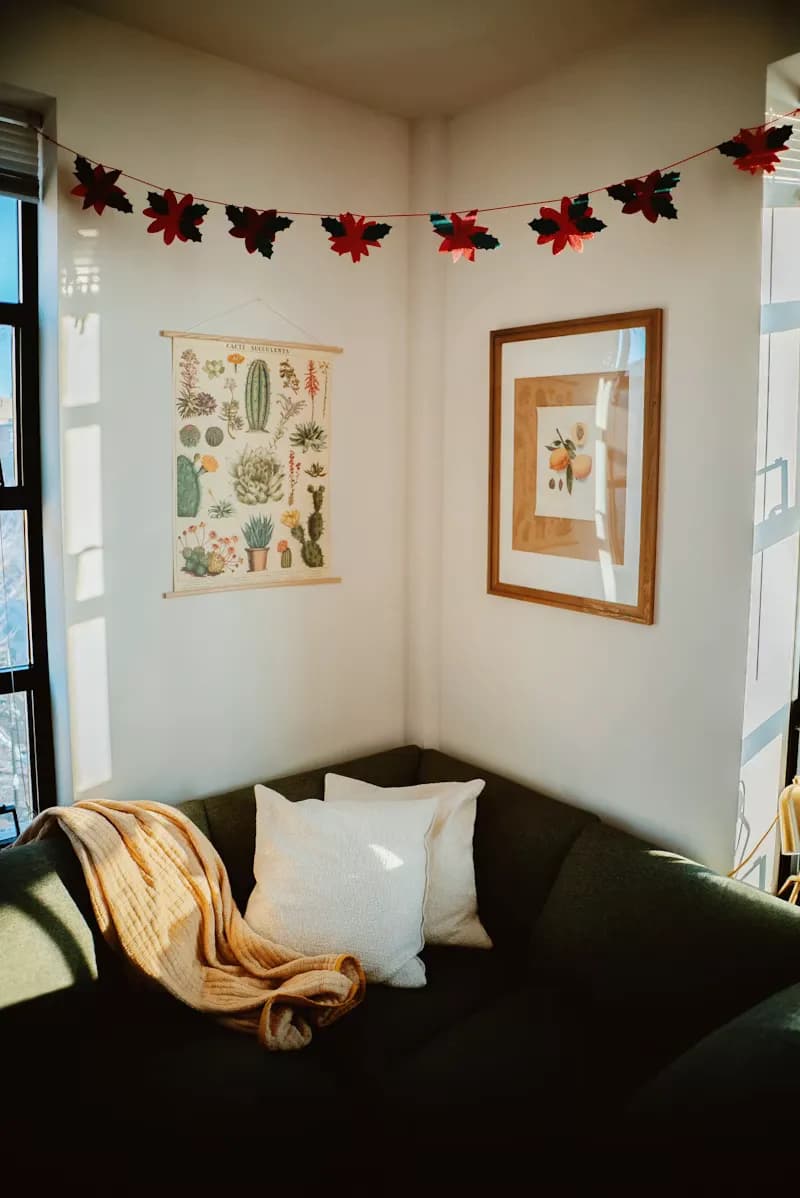 Living room with a single emerald accent wall and modern furniture